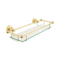 Glass shelf with gold metal brackets on a white background